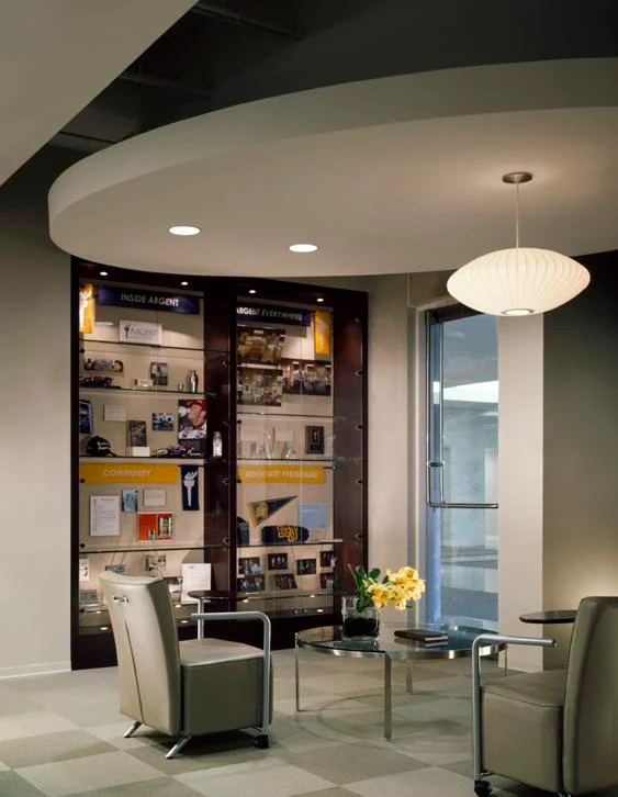 Training-center waiting area and display wall.