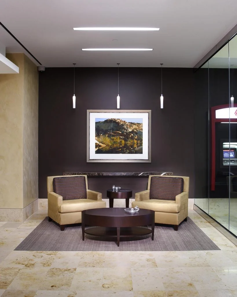 Waiting area beside an interior stair.