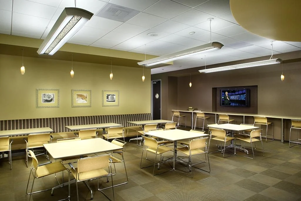 Shared café with tables and counter seating.