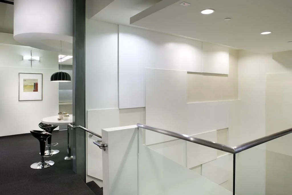 Interior landing and staircase at Koh & Patel.