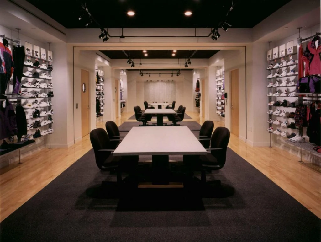 Meeting and display space with product shelving.