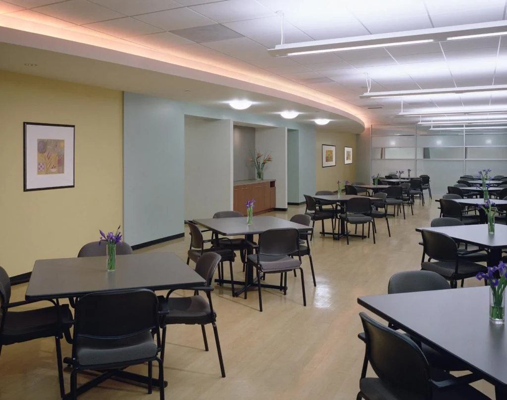 Staff dining area with tables and chairs.